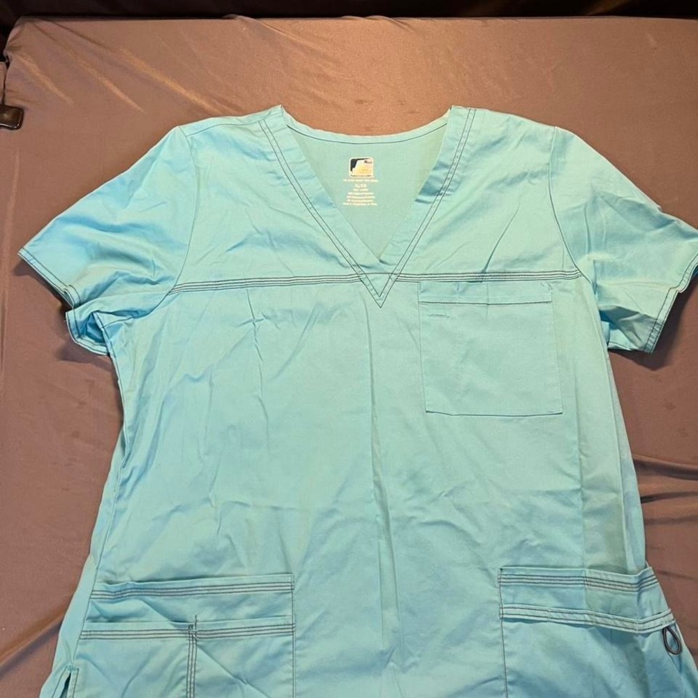 Adele blue scrub top with pockets